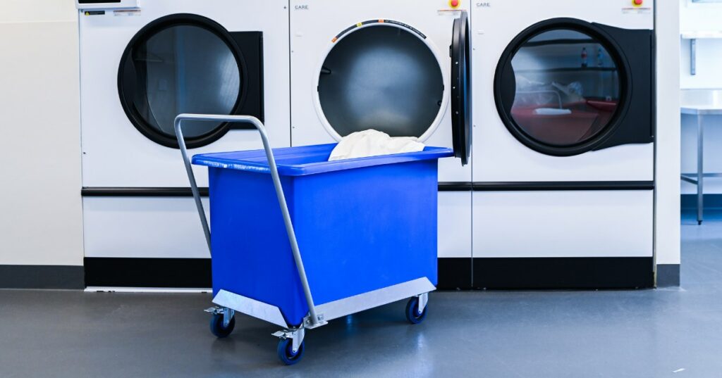 Blue plastic tub trolley in laundry room