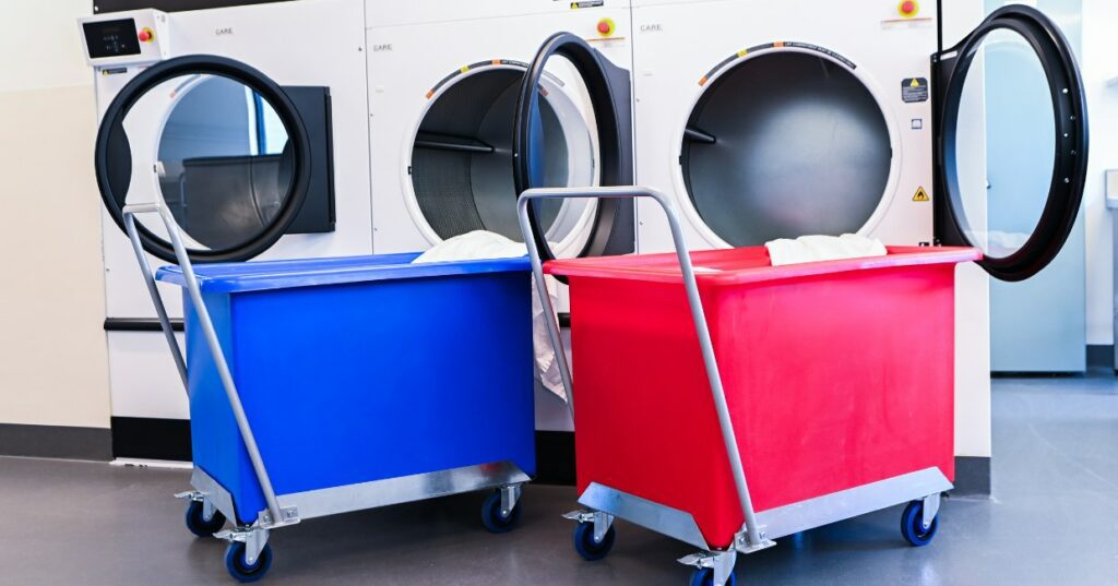 Blue and red plastic tub trolley in laundry room