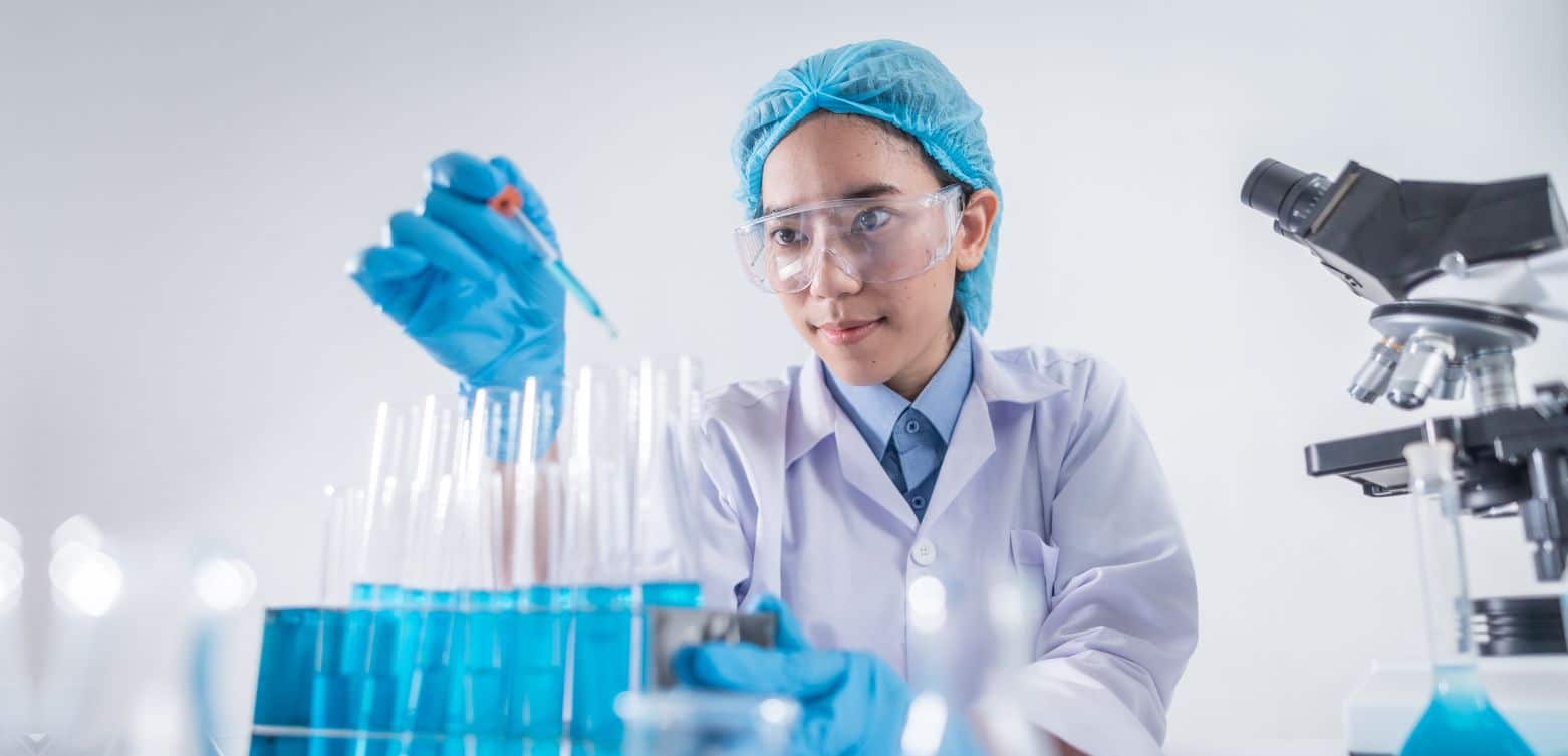 Woman in a lab testing chemicals